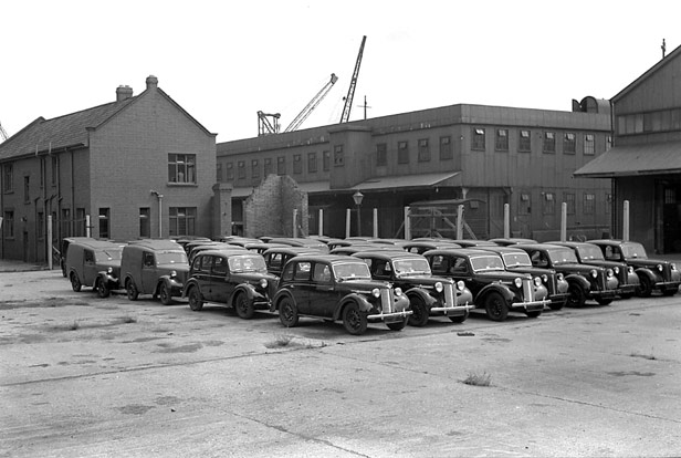 Vans & cars awaiting export, 1950s