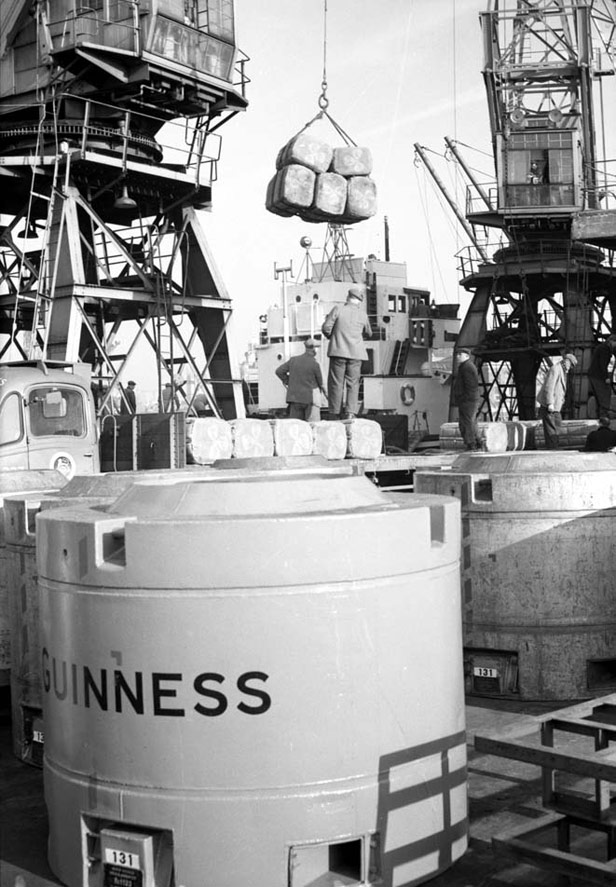 Discharging peat moss and Guinness containers, 3 February 1958