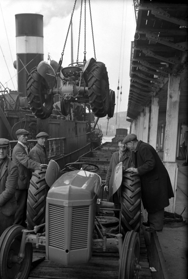 Tractors being hoisted from Quay at Z Shed