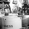 Discharging peat moss and Guinness containers, 3 February 1958