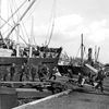 Preparing planks for running cargo, 14 October 1938