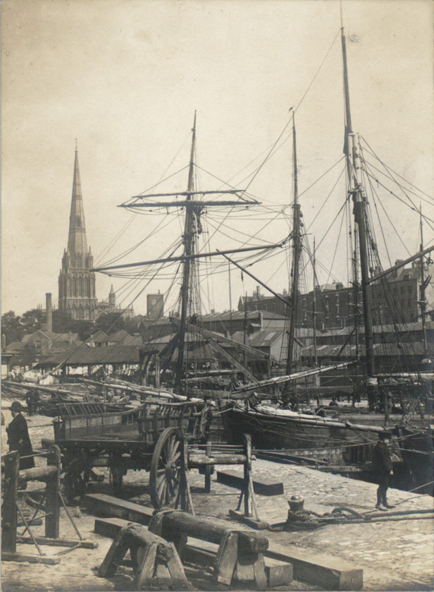 Small sailing vessels tied up at the Mud Dock